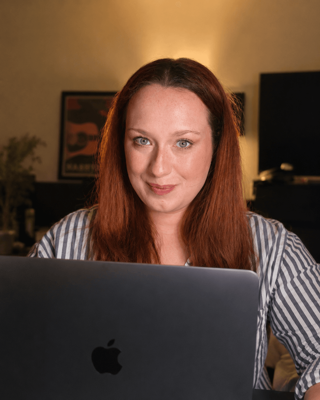The Gilt List editor reviewing fantasy and romantasy first chapters at a laptop
